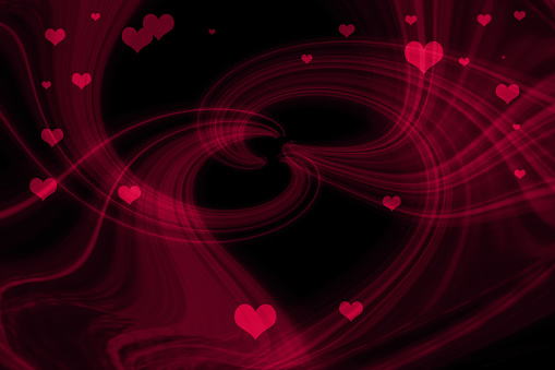 Abstract background made of glowing light trails forming a heart shape in the center with lots of small red hearts.