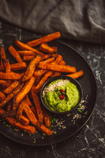 Sweet potato fries with pea guacamole