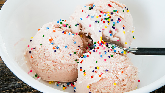 Close  up from ice cream in bowl with colorful sprinkles