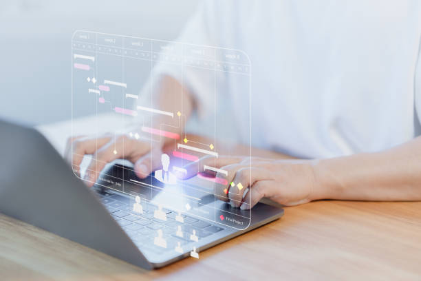 istock Employee working with computer in business analytic and data management system to make report with KPI and metric connect to database. Corporate strategy for operations, planning, marketing and HR. 1953472051