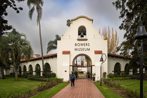 Santa Ana, California, U.S.A., - Dec. 28, 2023:  A person enters the Bowers Museum, an Orange County art museum notable for its pre-Columbian Mesoamerica, Native American, Asian, African, and Oceanic art.