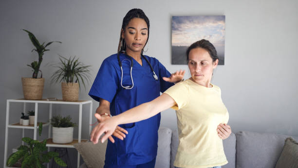 istock Latin female GP doing home visit. Home caregiver. 1953609400