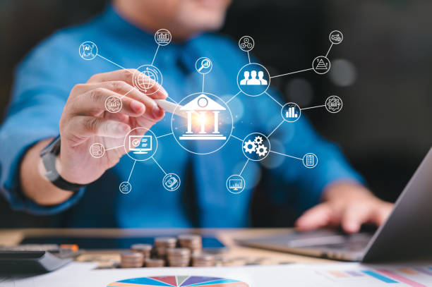 istock Success, banking, management concept. Businessman efficiently manages paperwork, optimizing banking and finance to drive profit, ensuring sustained business success, and fostering continuous growth. 1953679168