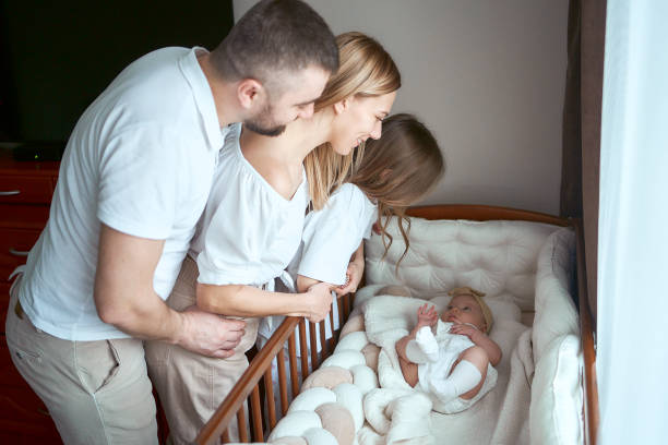 istock parents comfort their child in a cradle 1953680758