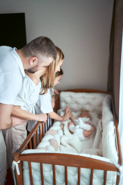 istock parents comfort their child in a cradle 1953680767