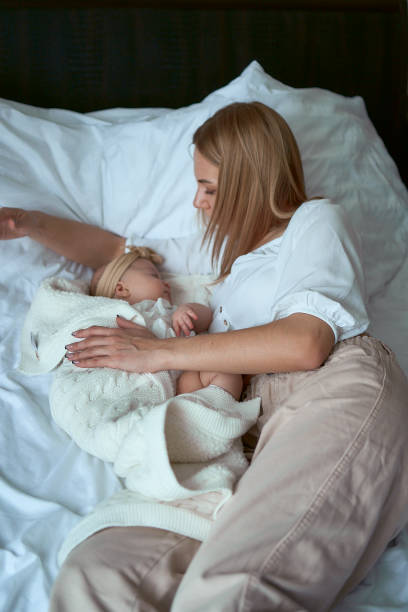 istock mother put her baby asleep 1953681285