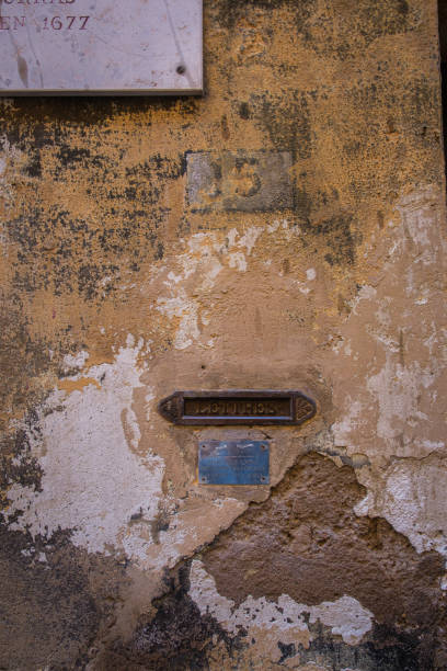 istock Old Plastered Wall Marked 15 with Letter Slot 1953698608