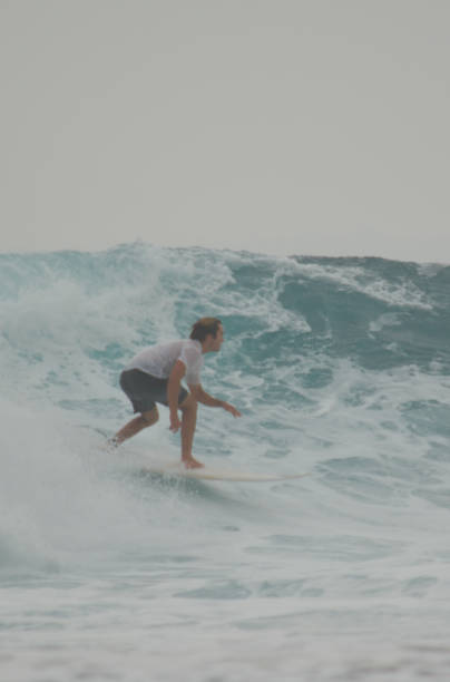 Krui, West Lampung, Indonesia, July 6, 2019. A surfer riding the wave at Tanjung Setia beach. Krui is located in West Lampung, Indonesia. lately, Krui had became one of famous tourism destination. It is known as a hidden paradise for the surfers all around the world. And Krui is an alternative surfing spot besides Bali.