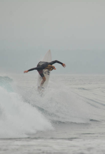 Krui, West Lampung, Indonesia, July 6, 2019. A surfer riding the wave at Tanjung Setia beach. Krui is located in West Lampung, Indonesia. lately, Krui had became one of famous tourism destination. It is known as a hidden paradise for the surfers all around the world. And Krui is an alternative surfing spot besides Bali.