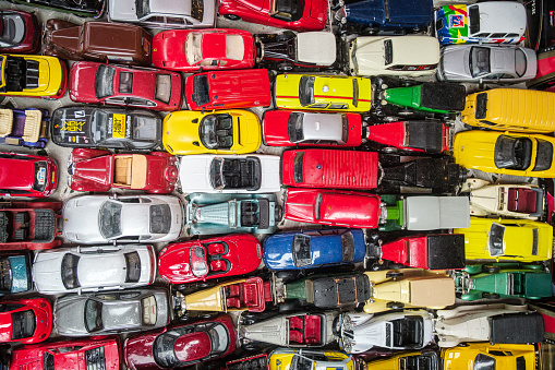 A full frame of multi-colored miniature toy cars.