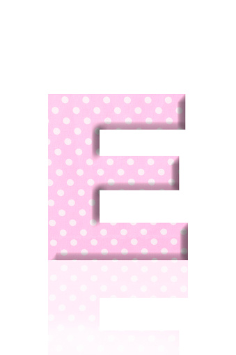 Close-up of three-dimensional polka dot alphabet letter E on white background.