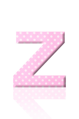 Close-up of three-dimensional polka dot alphabet letter Z on white background.