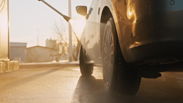 SLO MO Closeup of Pressure Water Sprayer Washing Car Tire at Self-Service Car Wash Station
