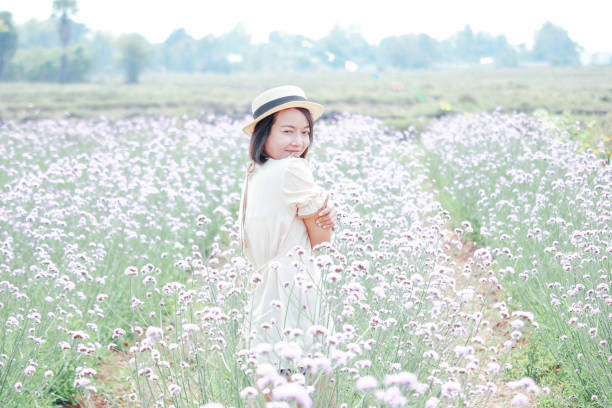 cute brown lady in flower field