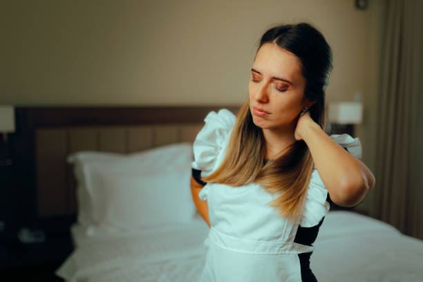istock Overworked Housemaid Feeling Exhausted and in Pain 1953859408
