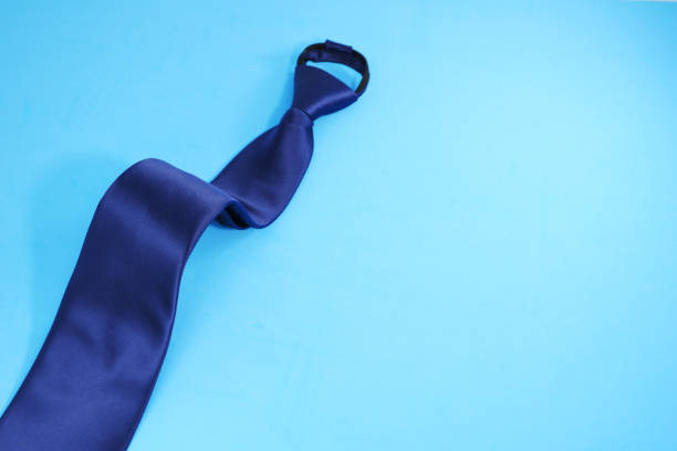 istock A zipper necktie folded isolated on blue background close-up view single object concept 1953862029