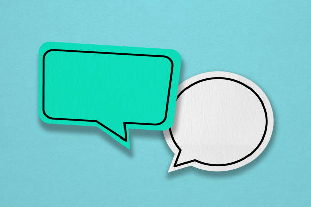 istock For conceptual image about communication and social media, customer feedback, Blank green and white grunge paper speech bubble on rough blue paper texture 1953884835