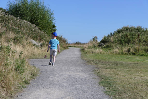A child walking up lane in the UK