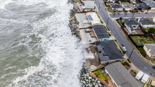 Pacifica PIer King Tides In the San Francisco Bay Area a Coastal Flood Advisory was issued for high astronomical tides potentially causing flooding for flood-prone, low-lying areas around the bay. Here in Pacifica, CA the pier was closed and damaged and roadways nearby were closed. california coast aerial stock pictures, royalty-free photos & images