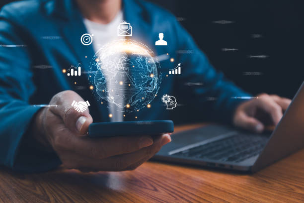 istock Businessman holding smartphone with virtual Global Internet connection. Global internet connection application technology and digital marketing, Financial and banking, Digital link tech, big data. 1954011426