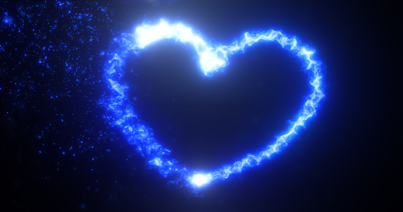 Glowing blue fire energy abstract heart made of particles and light for valentines day festive abstract background.
