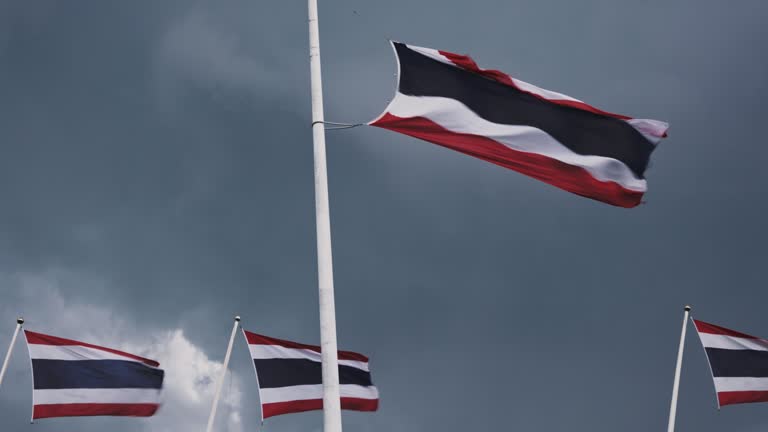 Thai flag and clouds during heavy rain