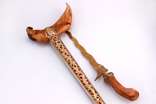 keris dagger is traditional weapon in indonesia. keris dagger make from metal and wood isolated on white. keris dagger is typical Javanese weapon full of occult, magical, supernatural things