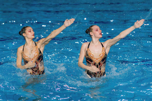 istock Grace and precision of a synchronized swimming duet, where two performers move in perfect harmony 1954134778