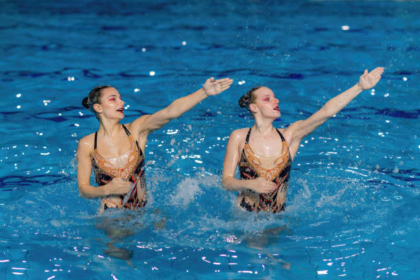 istock Synchronized swimming duet, where two performers move in perfect harmony 1954135161