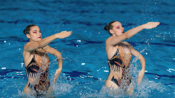 istock Artistry of synchronized swimming as this mesmerizing duet delivers a stunning performance, blending elegance and precision 1954135173