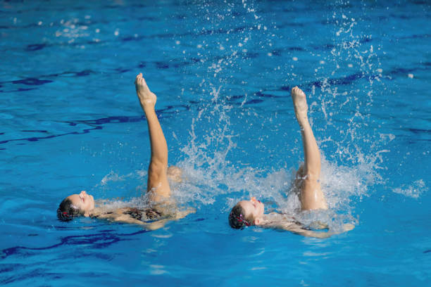 istock Synchronized swimming duo dances through the water, showcasing coordination and enchanting aquatic choreography 1954137249