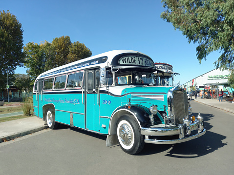 Avellaneda, Argentina - May 7, 2023: Old blue 1972 Mercedes Benz 911 bus for public passenger transport in Buenos Aires at a classic car show in a park. Traditional fileteado ornaments.