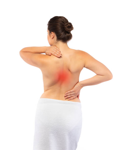 istock Young woman massaging back pain on white background 1954149374