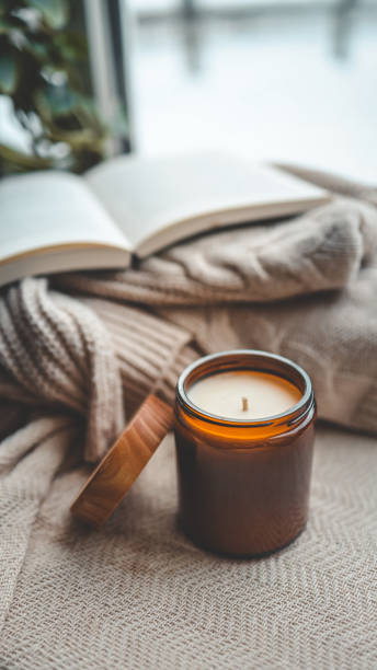 istock Burning candle in a cozy home interior 1954159354