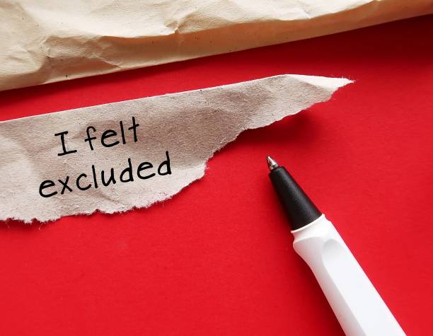 istock Torn envelope with handwriting on paper piece I FELT EXCLUDED - concept of Left-Out Feeling - not being part of the group - social rejection 1954173094