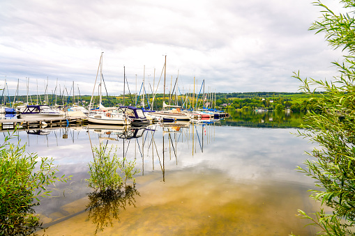 View of the Möhnesee and the surrounding landscape in the evening. Nature at the marina near Körbecke.
