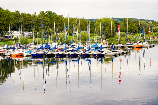 View of the Möhnesee and the surrounding landscape in the evening. Nature at the marina near Körbecke.