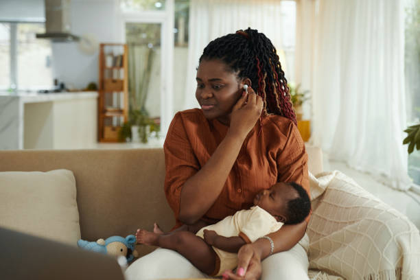 istock Mother Watching Educational Video when Baby is Sleeping 1954197904