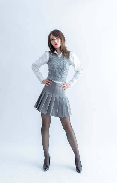 istock Confident young woman in formal clothes posing with hands on hips 1954198425