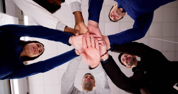istock Professional Business Team Huddle And Hands 1954208660