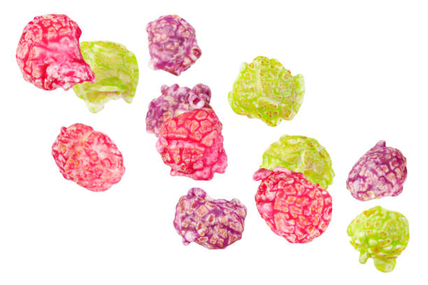 istock Levitation of colorful glazed popcorn isolated on white background. 1954209330