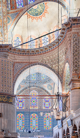Carved muqarnas vault, floral design, stained glass windows at Sultan Ahmed or Blue Mosque, Ottoman imperial mosque with blue tiles, Istanbul, Turkey