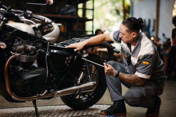 istock Repairman Fixing Motorcycle 1954221482