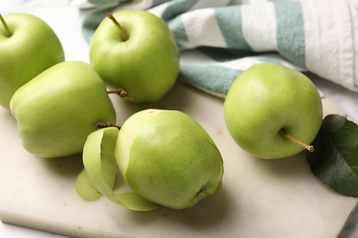 Ripe green apples on table, closeup view