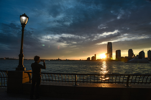 The Battery, formerly known as Battery Park, is a 25-acre (10 ha) public park located at the southern tip of Manhattan Island in New York City facing New York Harbor.