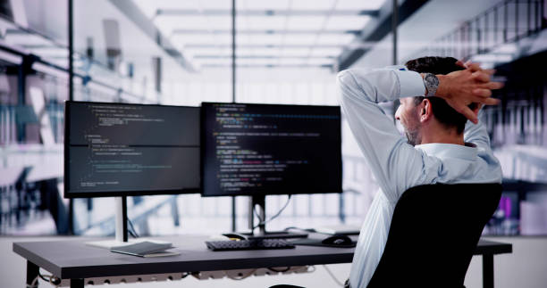 Happy Excited Male Programmer Raising Happy Excited Male Programmer Raising Arms In Office debug stock pictures, royalty-free photos & images