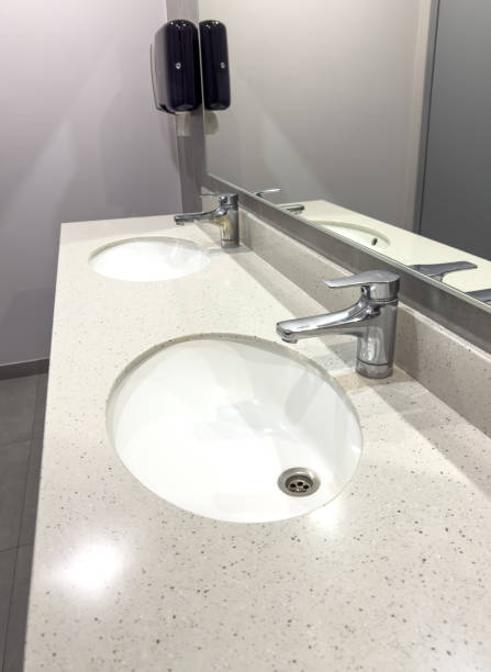 istock White washbasin with tap in the restroom 1954248542