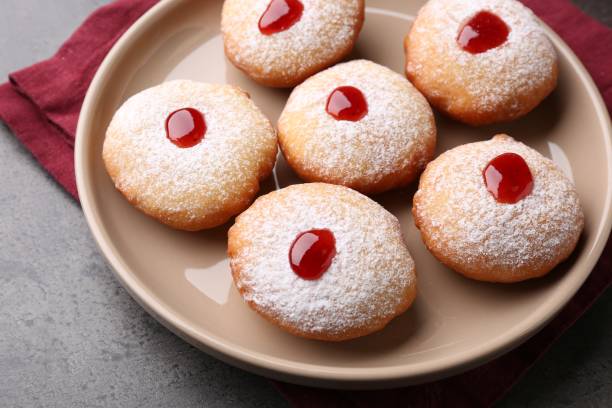 istock Hanukkah donuts with jelly and powdered sugar on grey table, closeup 1954253345