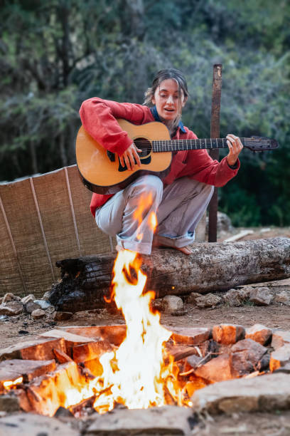 istock Woman singing in a fireplace 1954263047