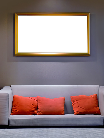 Interior mockup blank picture frame in horizontal with clipping path hanging on wall with decor bright interior, colorful sofa and backrest pillow or scatter cushion